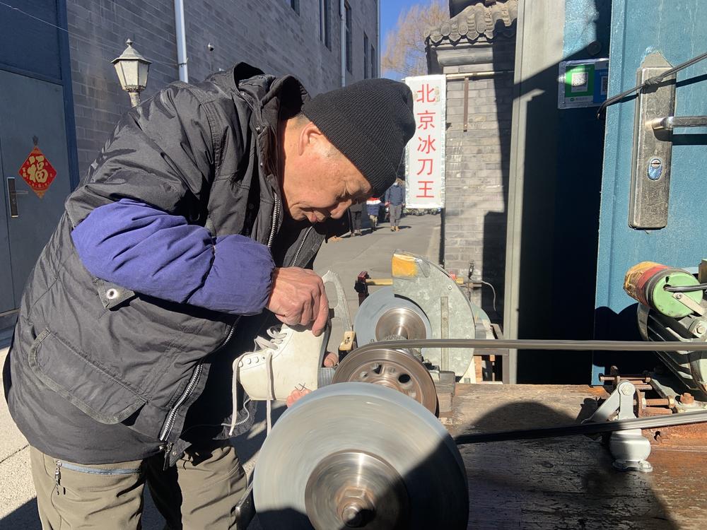 Wang Jianzhi, who runs a blade sharpening shop in Beijing, has no plans to watch the Games: 