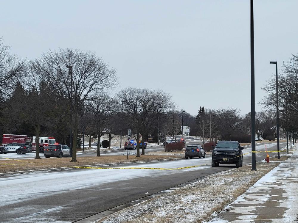 Officials respond to a shooting in Brown Deer, Wis. Three people are dead, including the suspect, police said.