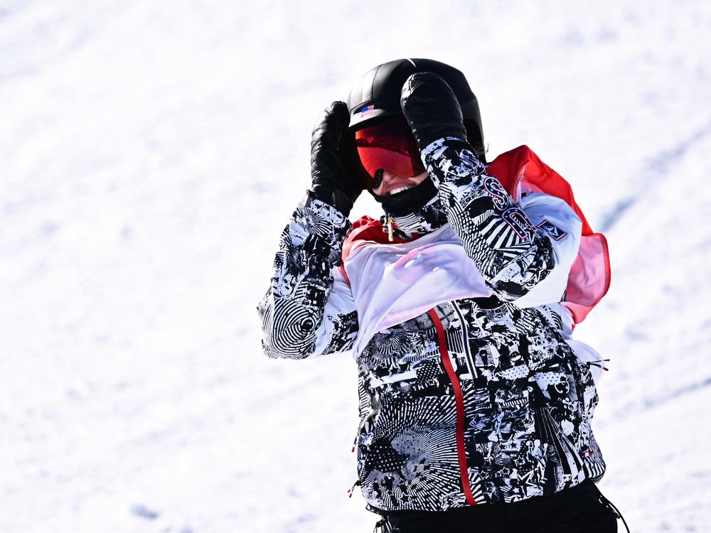 USA's Julia Marino reacts after crossing the finish line as she competes in the snowboard women's slopestyle final run during the Beijing 2022 Winter Olympic Games.