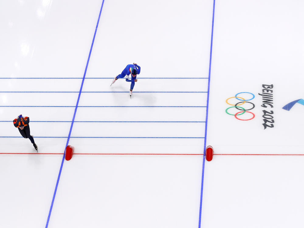 Irene Schouten of Team Netherlands crosses the line ahead of Francesca Lollobrigida of Team Italy during the women's 3000-meter on the first of the Beijing 2022 Winter Olympic Games at the National Speed Skating Oval.