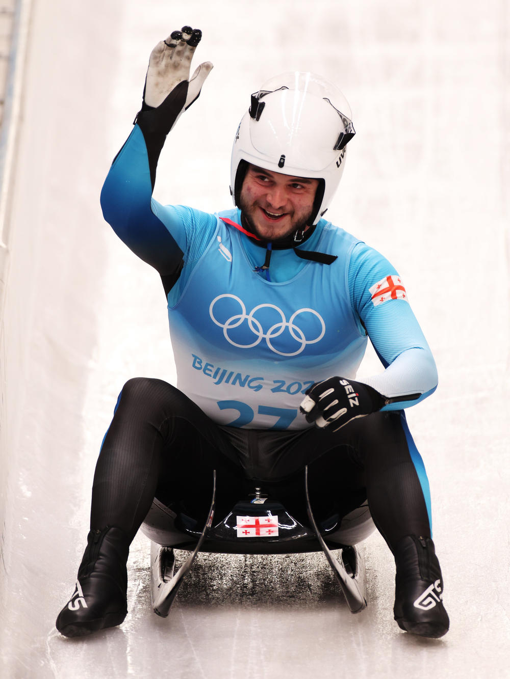 Saba Kumaritashvili of Team Georgia reacts after sliding during the Men's Singles Luge heats on day one of the Beijing 2022 Winter Olympic Games.