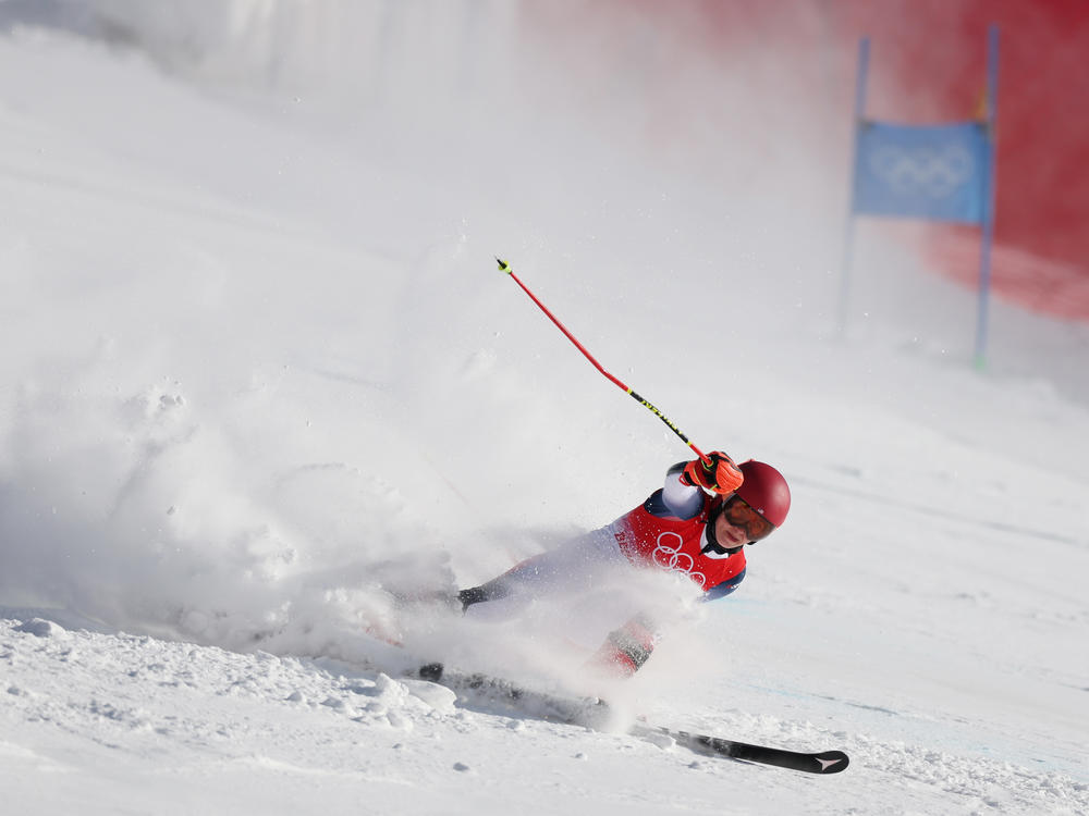 Mikaela Shiffrin falls during the women's giant slalom on day three of the Beijing 2022 Winter Olympic Games.