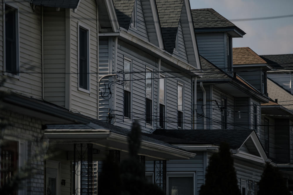 The early February sun hangs over the row of houses in Elizabeth, N.J., outside Simeria Dewalt's home, on Friday, Feb. 5, 2022.