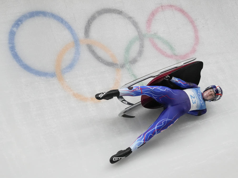 Summer Britcher, of the United States, was one of several racers who crashed during the luge women's singles run at the Beijing Winter Olympics on Monday, Feb. 7, 2022.