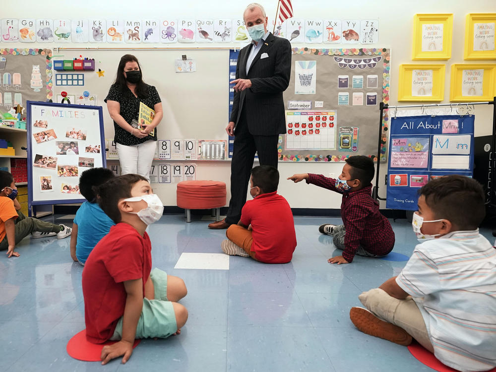 New Jersey Gov. Phil Murphy talks to 3- and 4-year-old students in a pre-K class at the Dr. Charles Smith Early Childhood Center in September 2021 in Palisades Park, N.J.