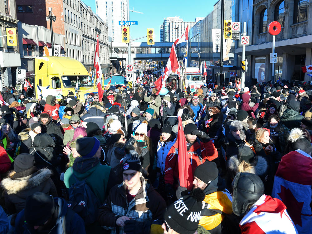 Demonstrators opposed to the Canada's COVID-19 mandates block the streets of Ottawa as they continue to protest on Saturday.