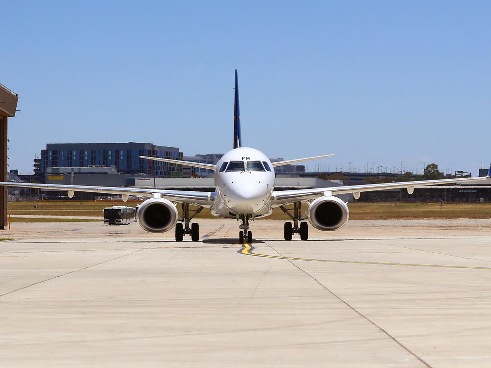 A plane sits at Melbourne Airport in December, ahead of the Australian Open. The country will reopen its international borders to visa holders and fully vaccinated travelers on Feb. 21.