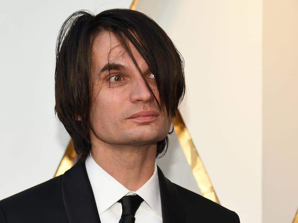 Composer Jonny Greenwood arrives for the Academy Awards on March 4, 2018, in Hollywood, Calif. Greenwood was nominated for an Oscar his work on  <em>Phantom Thread.</em>