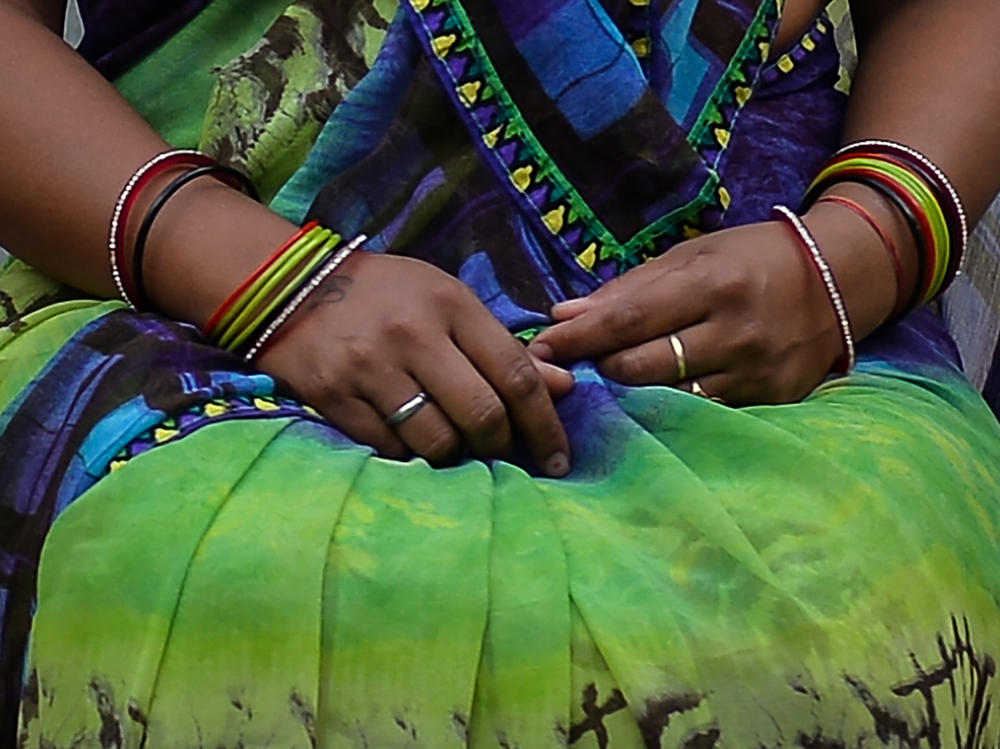A photograph of a woman who says she was a victim of marital rape. She is posing outside near her home in New Delhi. The Delhi High Court is now considering petitions that call for the criminalization of marital rape.