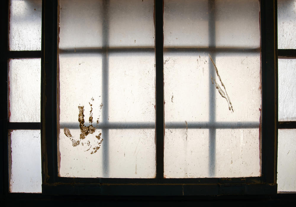 A handprint remains on the window at the Shiprock District Department of Corrections facility in New Mexico.