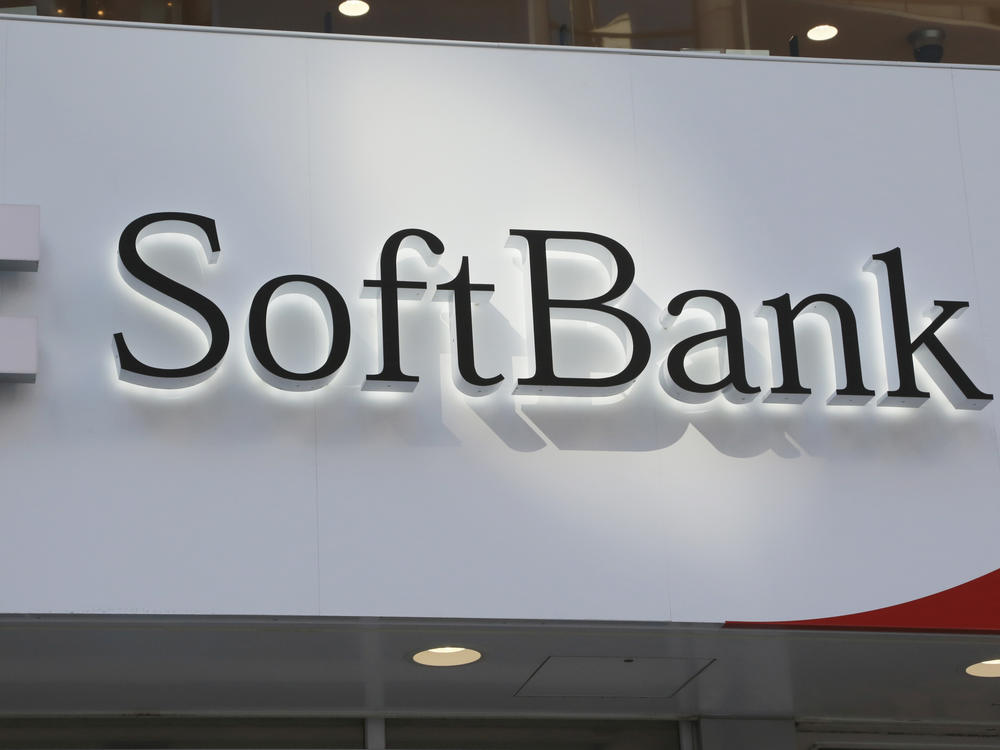 The logo of SoftBank Corp. is seen at a shop in Tokyo on Monday. Profit at the Japanese technology investor has tumbled as the value of its sprawling investments declined and its planned sale of British company Arm collapsed.