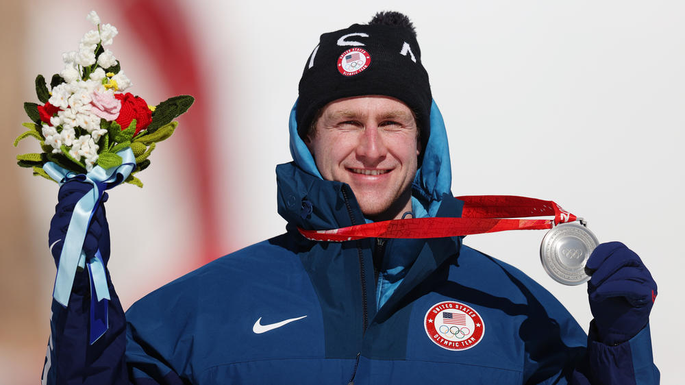Team USA's Ryan Cochran-Siegle celebrates his silver medal in the super-G at the Winter Olympics. He's the sixth member of his family to compete at an Olympics.