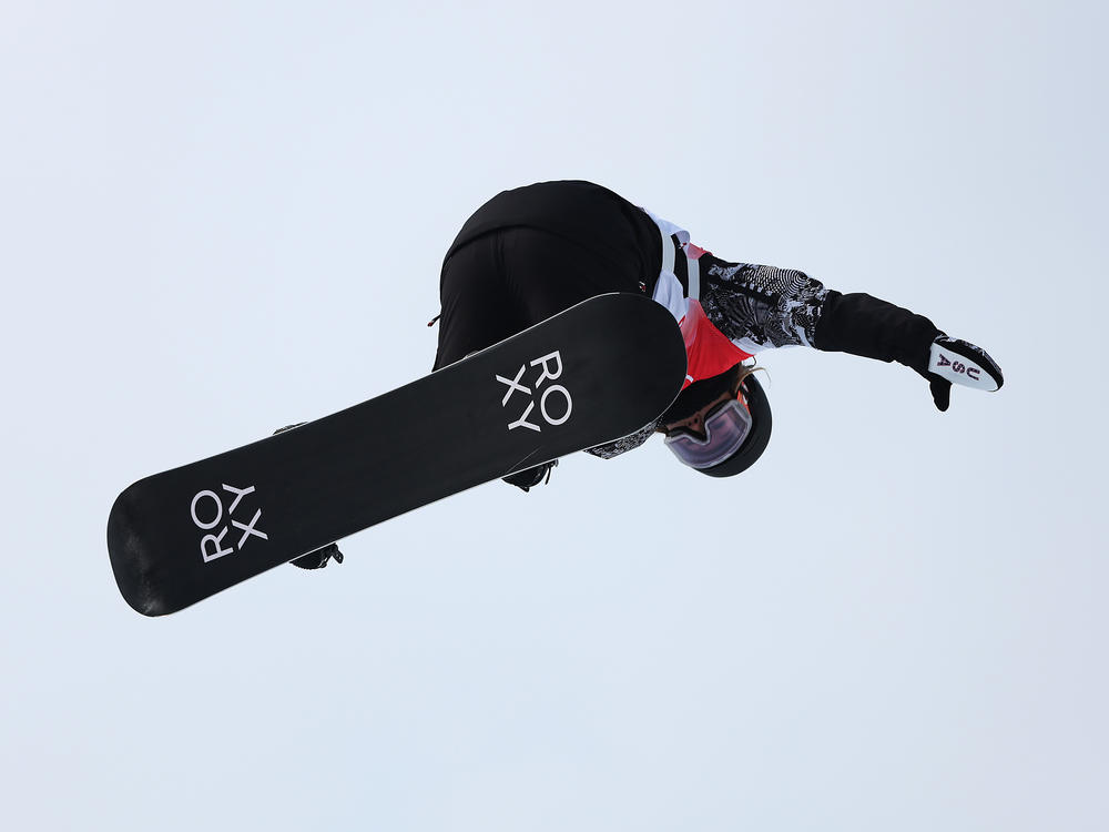 Returning snowboard halfpipe champ, Chloe Kim, performs a trick during qualification at the Beijing 2022 Winter Olympic Games.