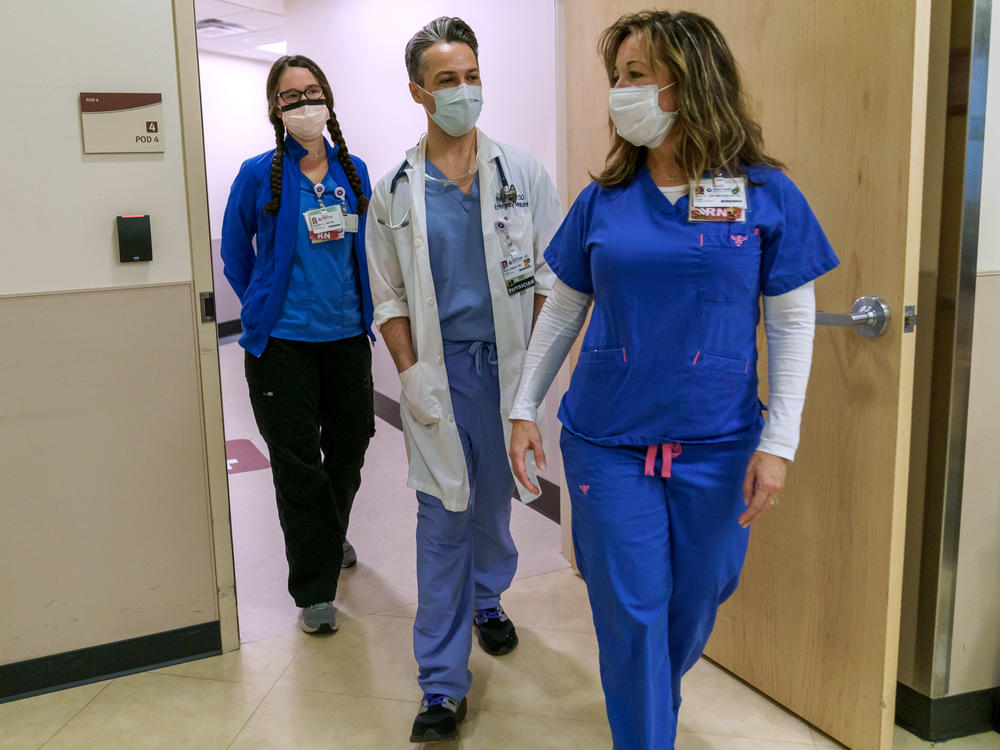 (Left to right) Clinical nurse Heather Gatchet, Dr. Peter Hakim, and emergency room nurse manager Nancy Bee head into the emergency department at Salem Health, on Jan. 27, 2022 in Salem Oregon. Salem Health had 540 patients on Jan. 27, but only 494 beds available.