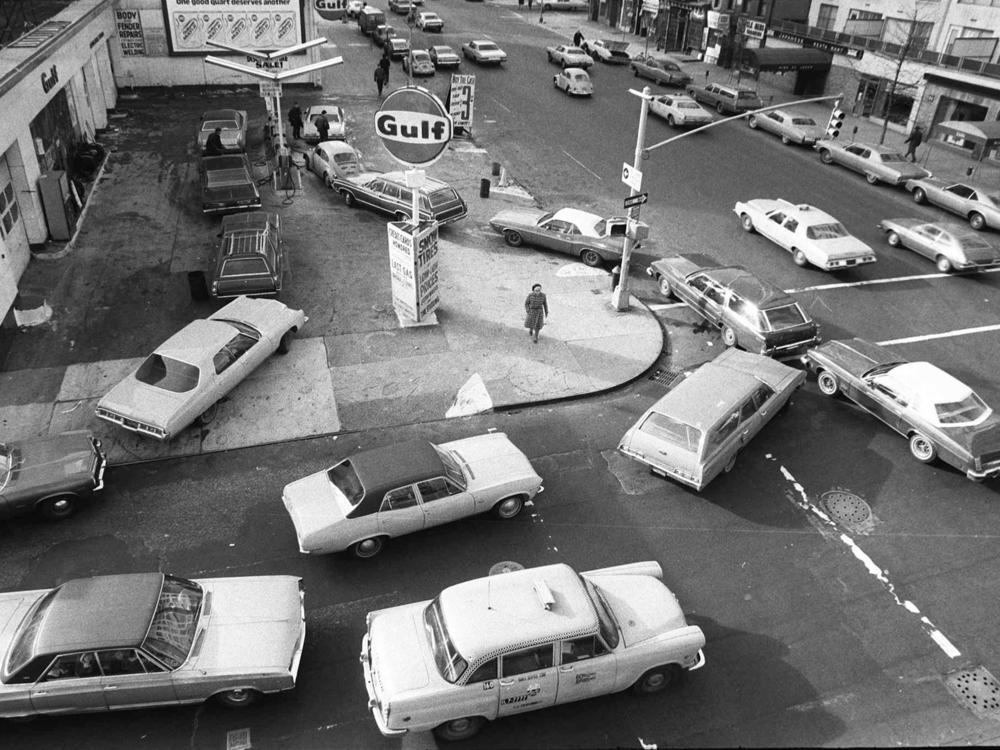 In this Dec. 23, 1973, file photo, cars line up in two directions at a gas station in New York City. It was a time when the country was experiencing surging energy prices.