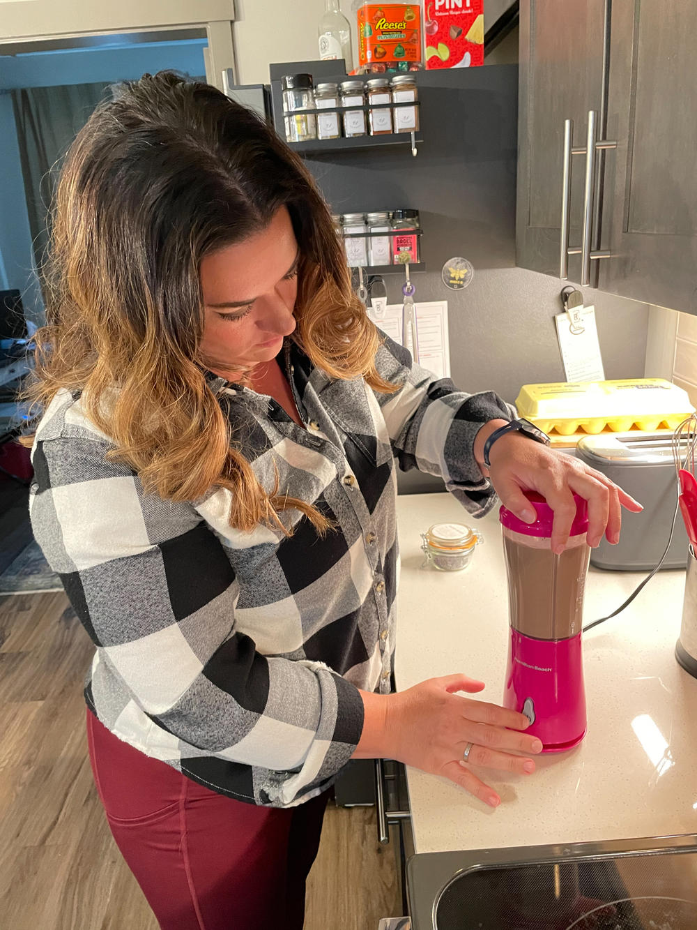 Sara Dean makes an energy smoothie for her daughter to take to tumbling practice. Supporting her daughter's love of cheerleading and need for social connection brought them off the road after nearly two years of travel nursing during the pandemic.