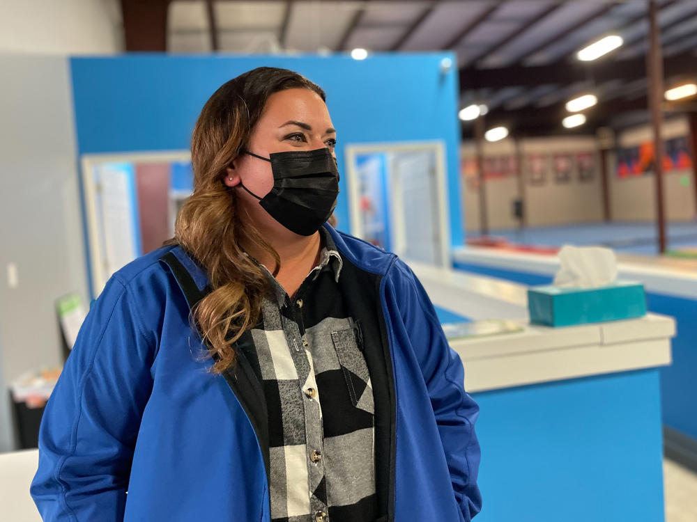 Nurse Sara Dean of Mount Juliet, Tenn., attends her daughter Harper's gymnastics practice. Dean spent nearly two years travelling the country as a nurse, gaining a much higher salary than she could at home.