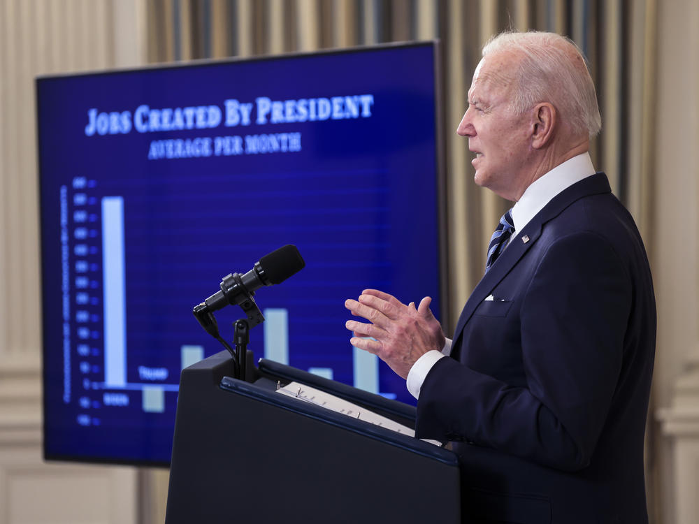 President Biden showed off a chart comparing strong job creation during his first year to that of previous presidents. But economists say surging inflation is top of mind to voters.