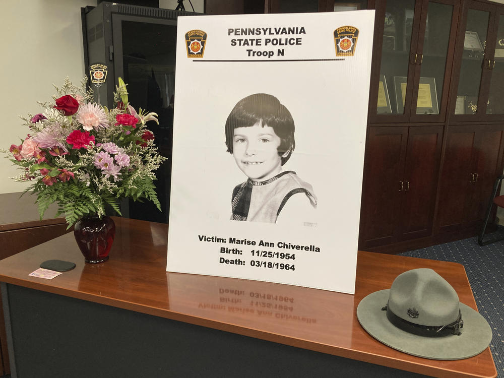 A poster of Marise Ann Chiverella is displayed with a vase of flowers and a trooper's hat at a Pennsylvania State Police news conference in Hazleton, Pa., Thursday.