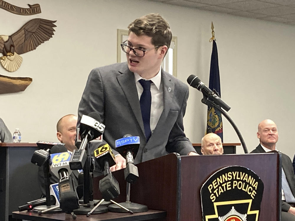 Eric Schubert, a 20-year-old college student and genealogy expert, center, addresses a Pennsylvania State Police news conference in Hazleton, Pa., Thursday.