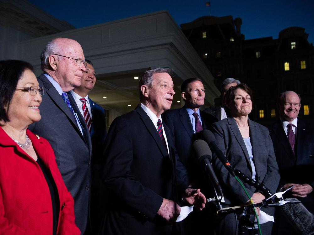 Democratic members of the Senate Judiciary Committee, including Chairman Dick Durbin (center) of Illinois, speak to reporters following a meeting with President Biden about the Supreme Court vacancy.