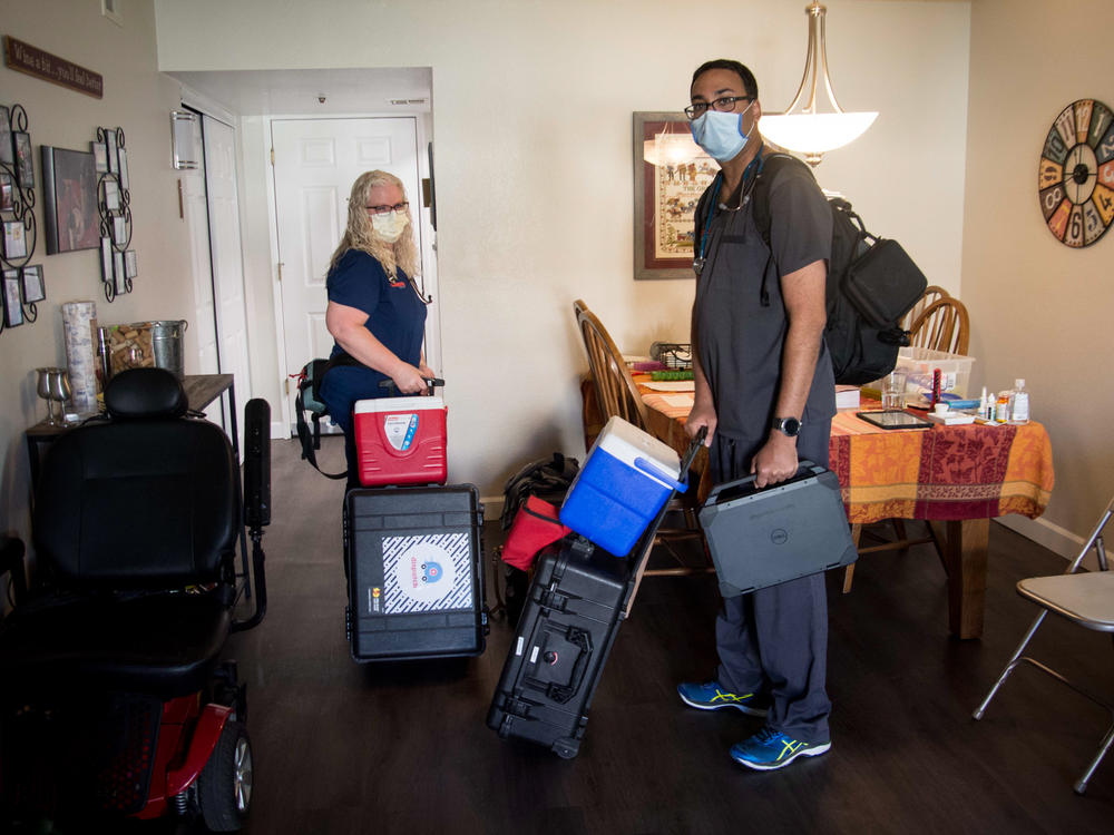 Nurse Tami Hampson and Dr. Vinay Shah with DispatchHealth arrive at the Wiese family's apartment for a medical visit on January 3, 2022.