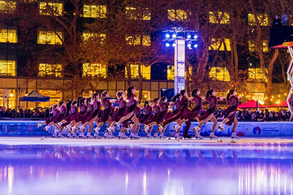 The Haydenettes glide across the ice at the Bryant Park tree lighting in New York.
