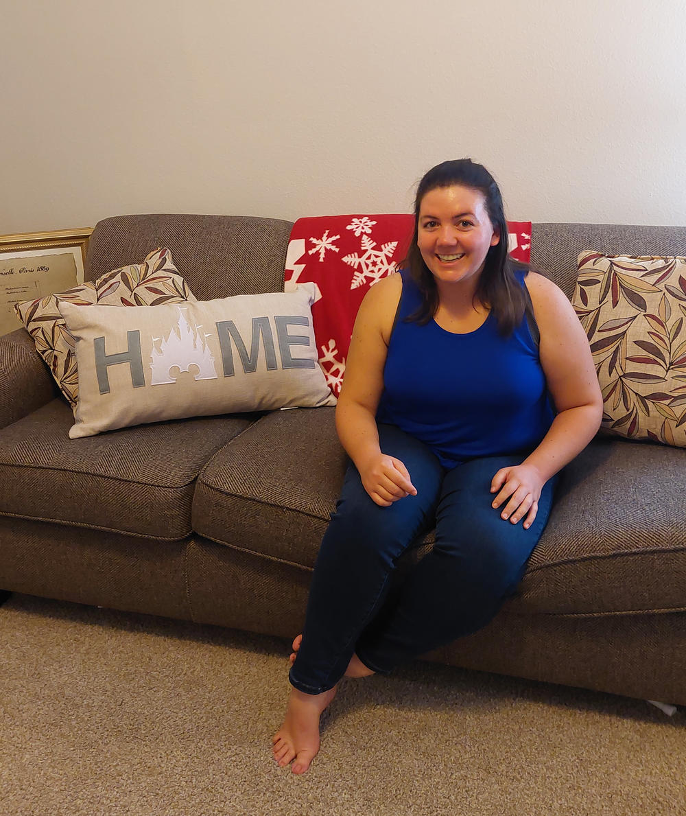 Laura Kraft in her apartment in the Orlando area. She moved across the country for a new job and couldn't believe how much it cost to rent a place.