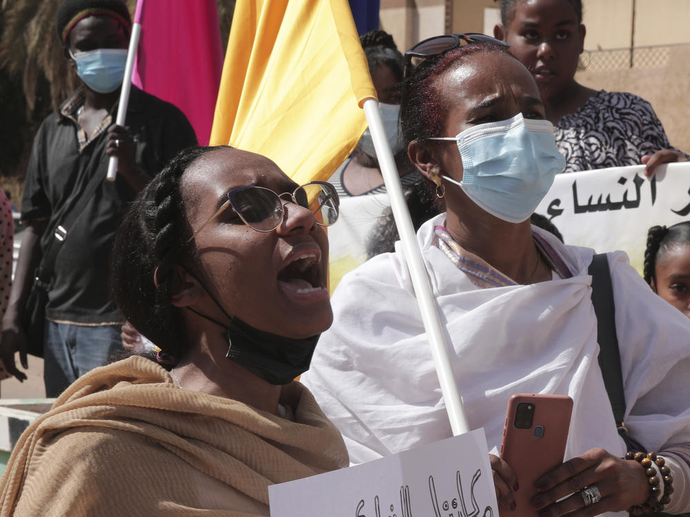 Women chant slogans protesting violence against women and demanding the release of all detainees before the U.N. rights office in Khartoum, Sudan, Feb. 2, 2022.