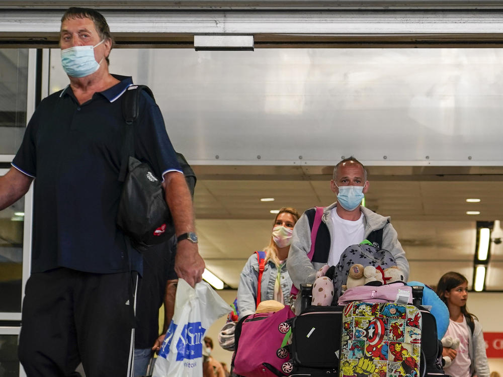 Passengers arriving at Gatwick Airport in London. Starting today, British residents and visitors who have had at least two doses of a coronavirus vaccine only need to fill out a form before entering the U.K.