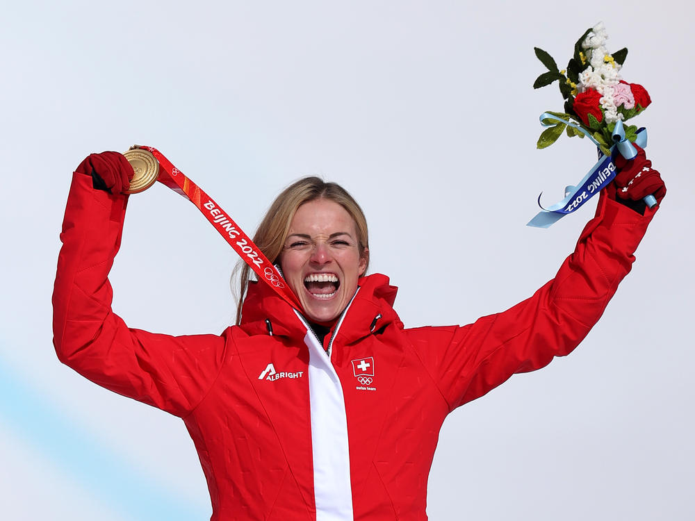 Swiss alpine skier Lara Gut-Behrami celebrates winning her gold medal in the women's super-G at the Beijing Winter Olympics on Friday.