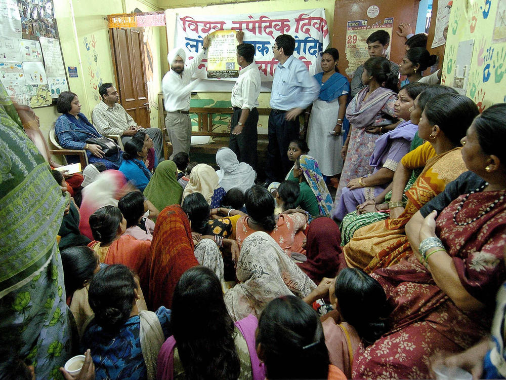 Health workers share information about tuberculosis with residents of aslum neighborhoods in New Delhi. India has the greatest number of TB cases in the world.