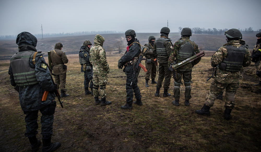 Ukrainian troops train with small arms on March 13, 2015, outside Mariupol, Ukraine. The Minsk ll ceasefire agreement, which has continued to hold despite being violated more than 1,000 times, nears the one-month mark.