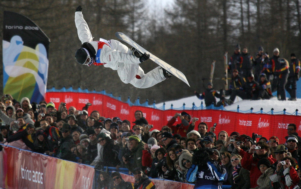 White competes during the men's snowboard halfpipe finals at the Turin 2006 Winter Olympics.