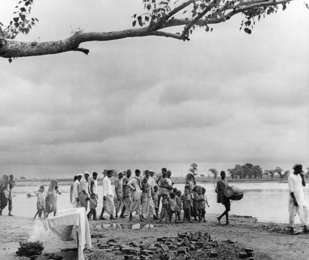 A village drummer announces the arrival of the tuberculosis vaccine during an immunization campaign in India in the 1950s.