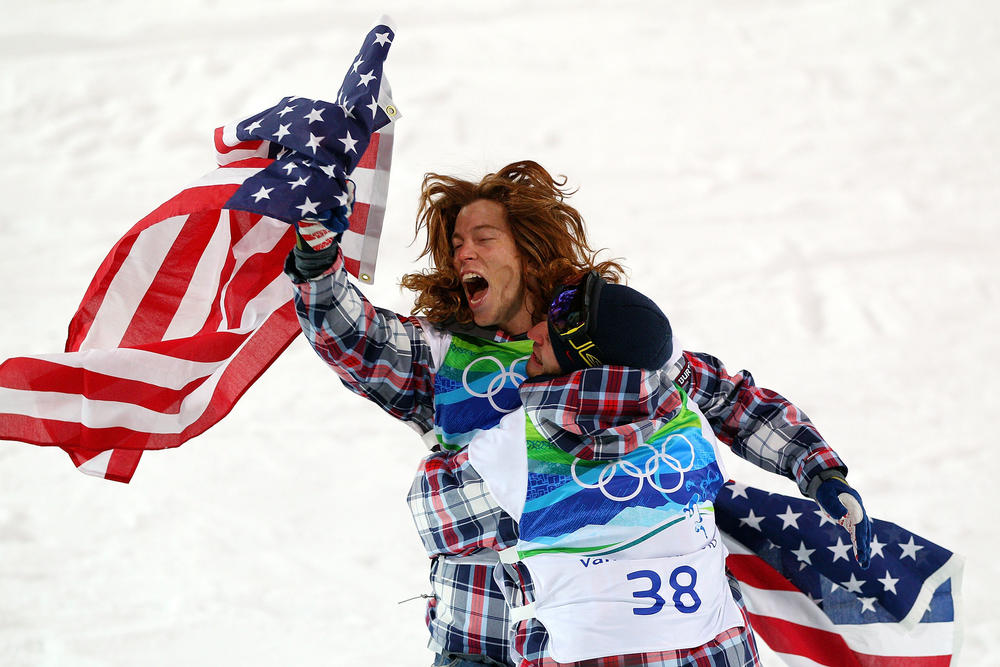 White celebrates with a teammate after he won the gold medal in the men's halfpipe final at the Vancouver 2010 Winter Olympics.