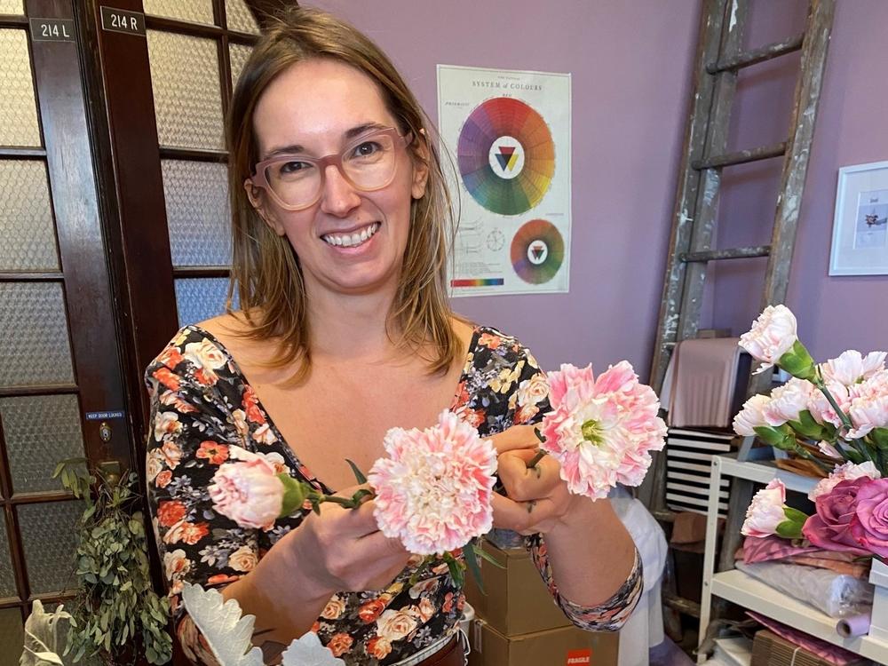 Simmons holds up her fluffed carnations, a technique used to give the flowers more dimension.