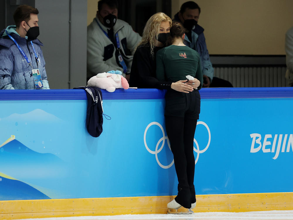 Kamila Valieva of Team ROC stands with coach Eteri Tutberidze during a figure skating training session at the Beijing Winter Olympics on Saturday, February 12, 2022.