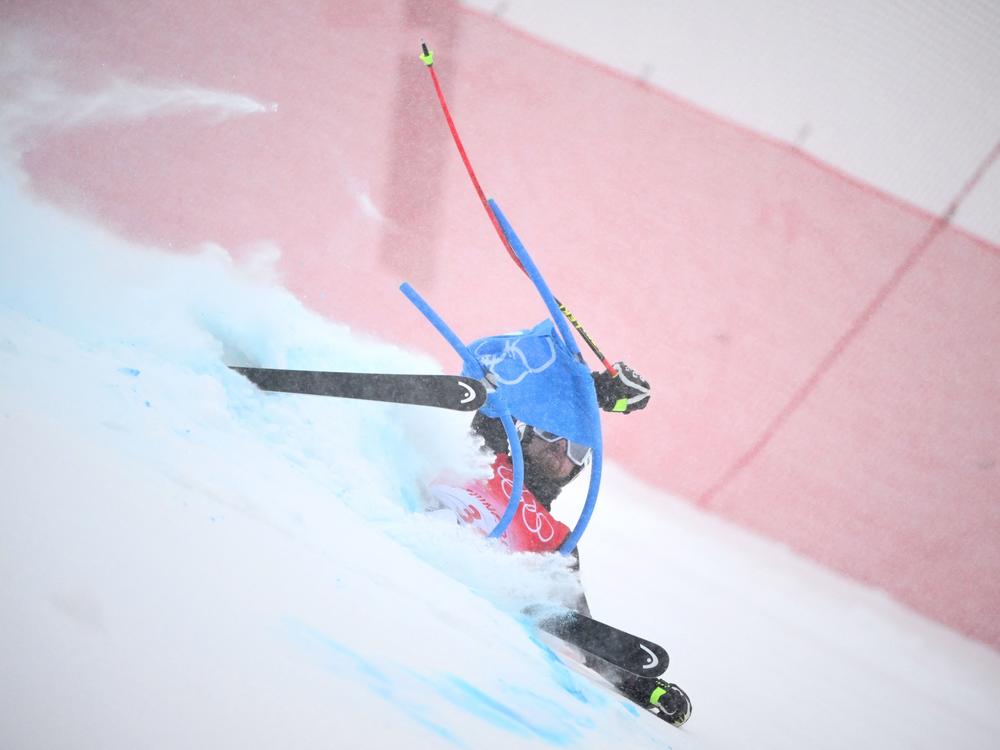 Finland's Samu Torsti falls in the first run of the men's giant slalom on Feb. 13 at the Beijing 2022 Winter Olympic Games.