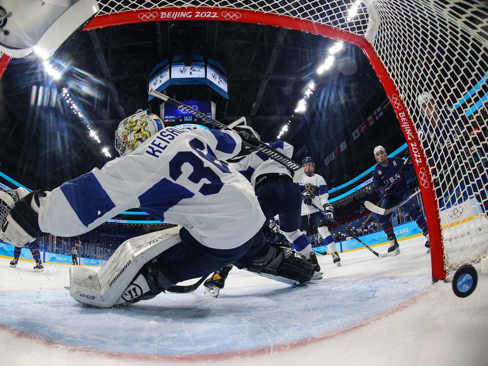 Finland's goaltender Anni Keisala concedes the first goal of the night during the women's ice hockey semifinal match of the Beijing 2022 Winter Olympic Games.