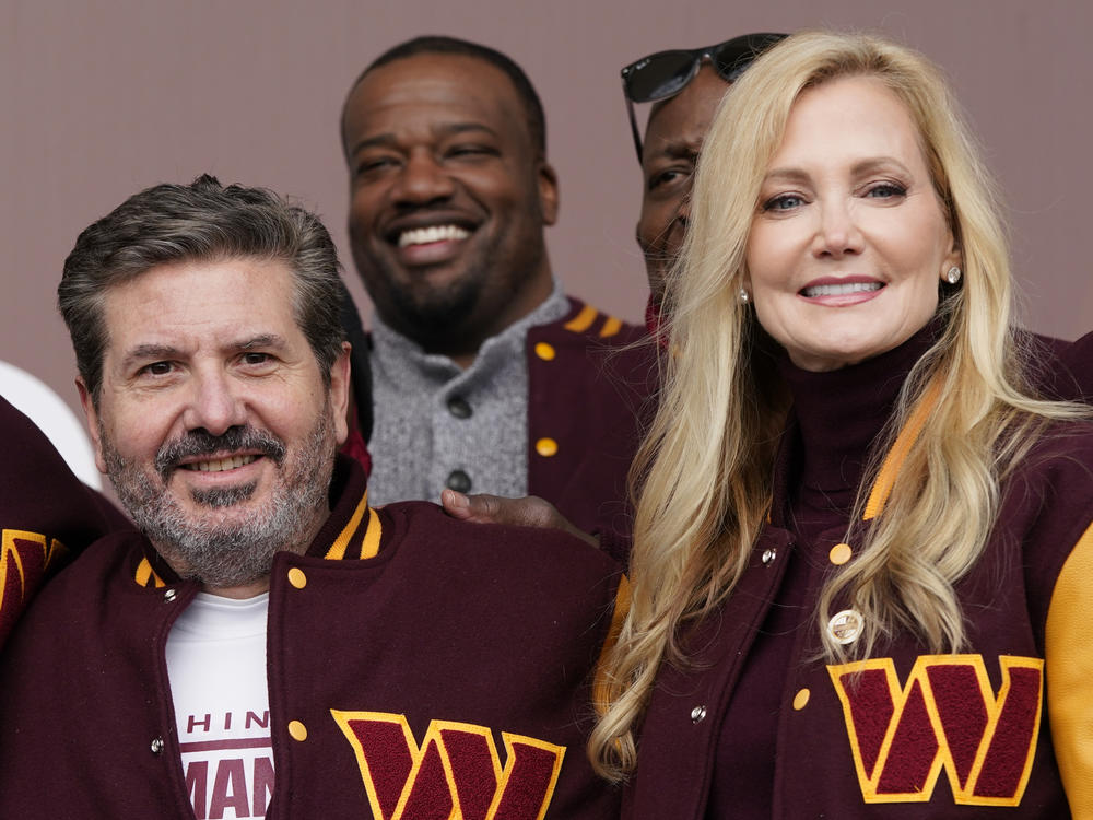 Dan and Tanya Snyder, co-owner and co-CEOs of the Washington Commanders, pose for photos after unveiling their NFL football team's new name on Feb. 2. The House Oversight Committee announced Tuesday it's reviewing more material related to the team's investigation of workplace misconduct.
