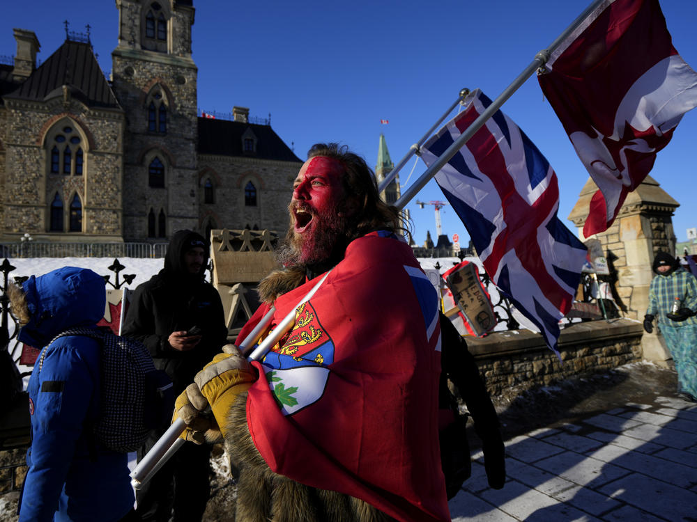 A protester yells 