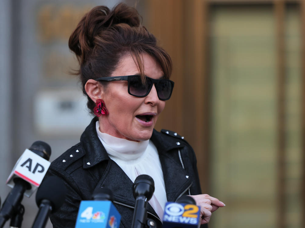 Former Republican vice presidential candidate Sarah Palin speaks with reporters as she leaves federal court on Feb. 14 in New York City.