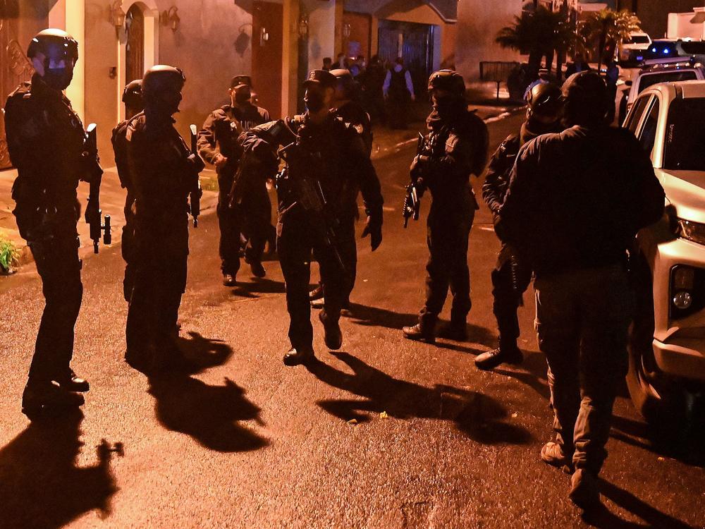 Members of the police special forces arrive at the home of former Honduran President Juan Orlando Hernandez in Tegucigalpa on Feb. 14, 2022.