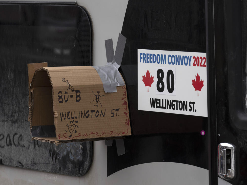A cardboard mailbox is taped to the side of a camper being used in protests against COVI-19 mandates on Wednesday in Ottawa.