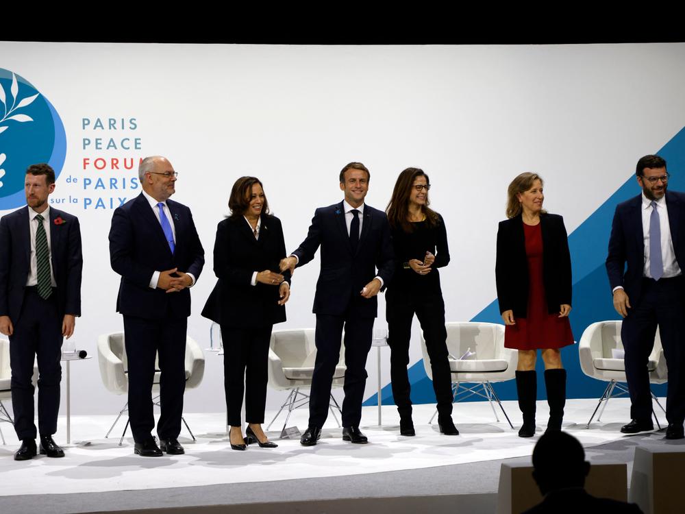 Vice President Harris met with French President Emmanuel Macron (C) and other European political and business leaders during a Paris trip in November.