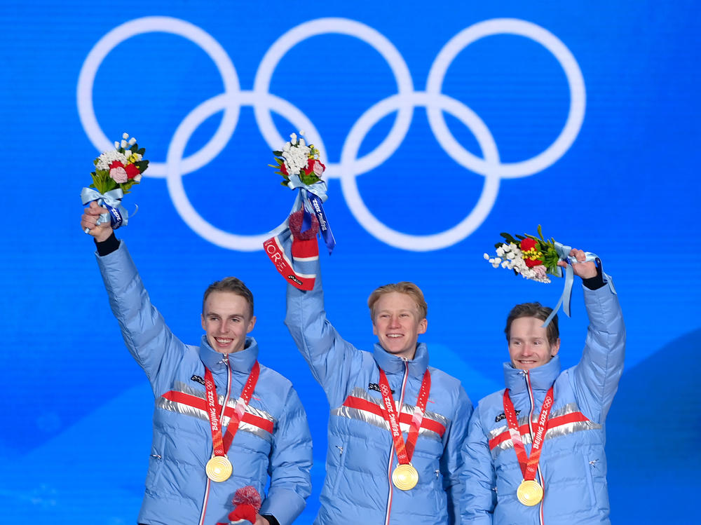 Gold medallists Hallgeir Engebraaten, Peder Kongshaug and Sverre Lunde Pedersen of Team Norway pose during the Men's Team Pursuit medal ceremony at the Beijing 2022 Winter Olympics on February 15, 2022.