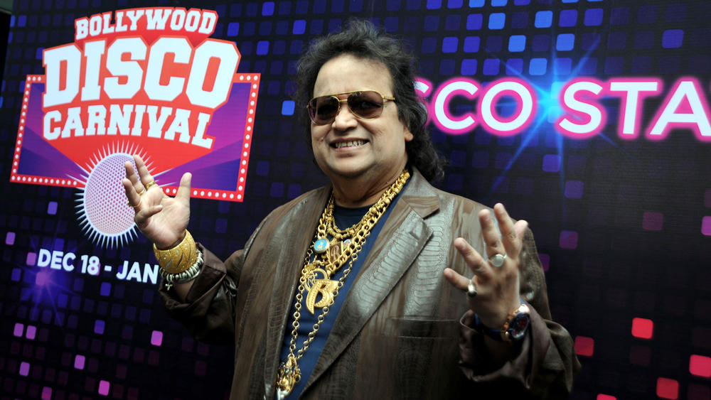 Indian Bollywood music composer and singer Bappi Lahiri poses during the Christmas and New Year's Bollywood Disco Carnival in Mumbai in December 2015.