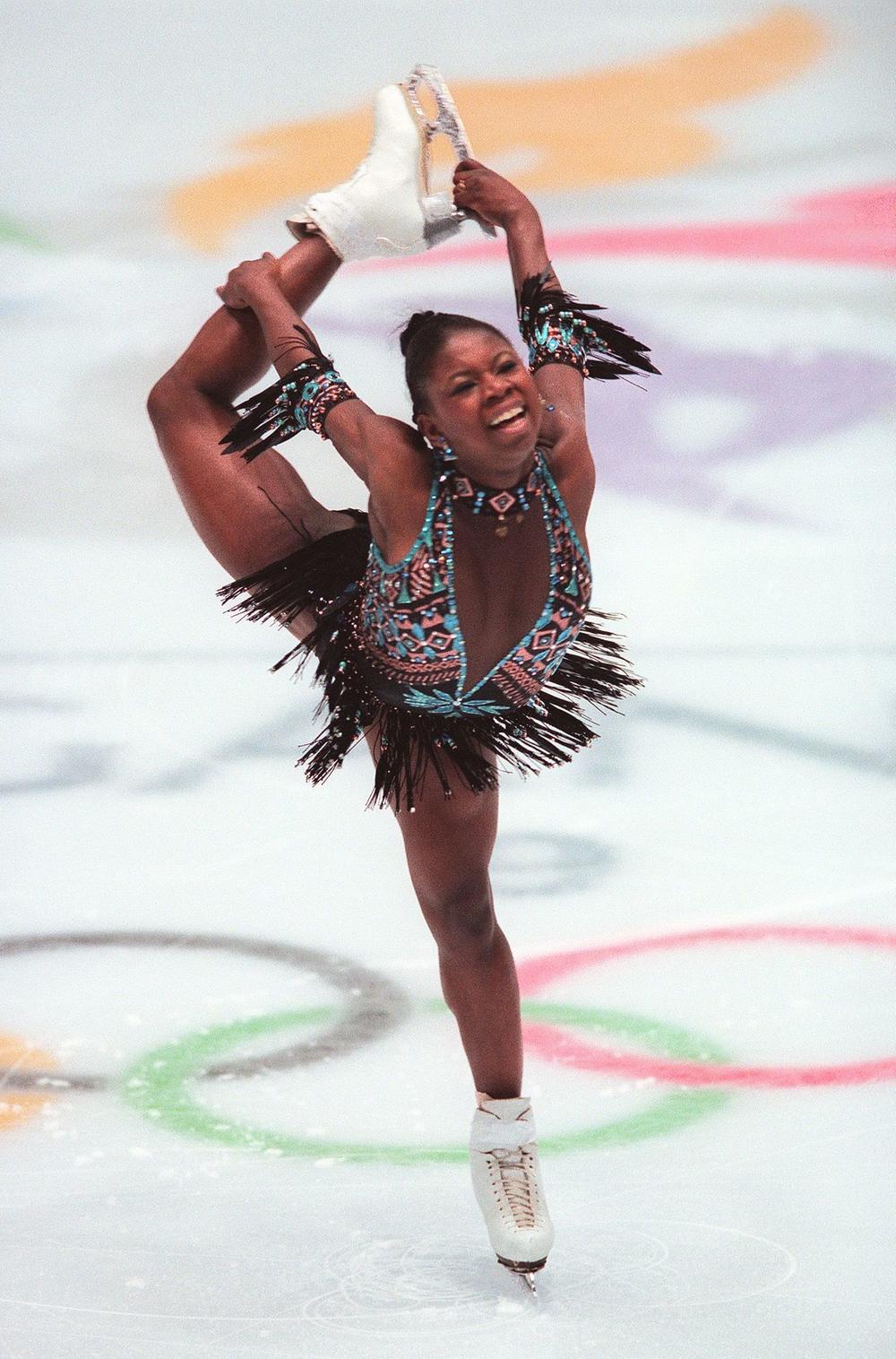 Surya Bonaly of France performs her short program in the women's figure skating competition at the 1998 Nagano, Winter Olympics. Bonaly was the first woman to attempt a quad jump in competition.