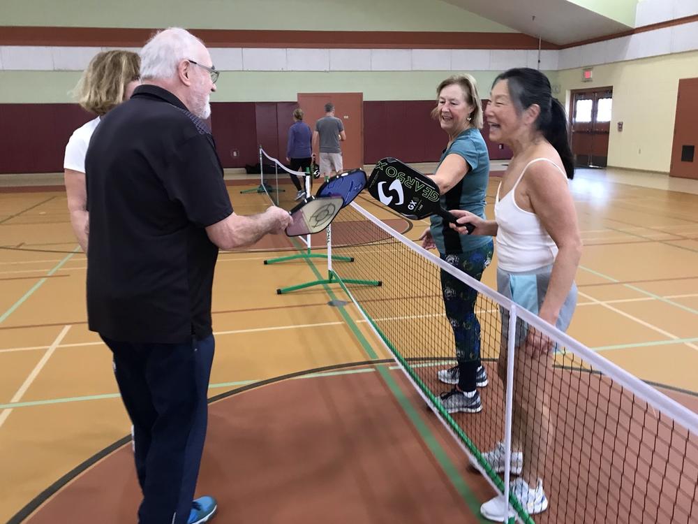 Freida Yueh (right) says of the increasingly popular sport of pickleball: 
